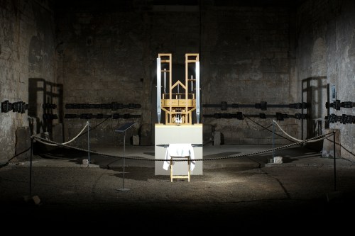 FILE - The organ of the John Cage organ project is illuminated prior to a 'sound change' at the Buchardi Church in Halberstadt, Germany, Sept. 5, 2020. (AP Photo/Markus Schreiber, File)