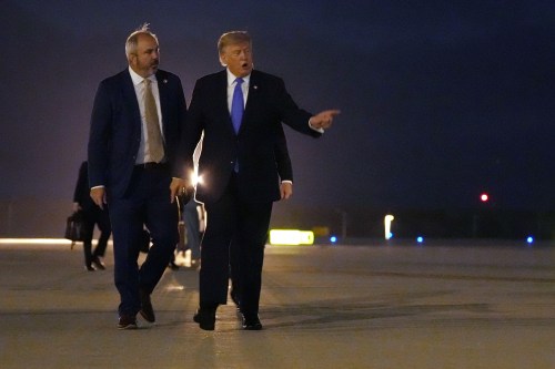 President Donald Trump walks to board Air Force One, Tuesday, Aug. 4, 2026, at Los Angeles International Airport in Los Angeles. (AP Photo/Mark Schiefelbein)