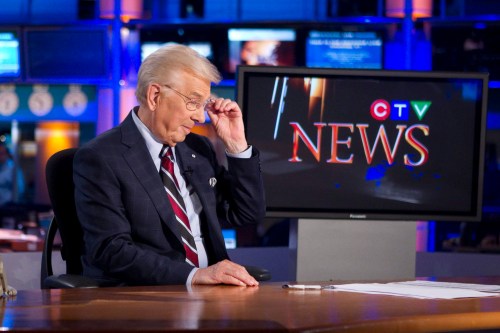 CTV news anchor Lloyd Robertson takes his glasses off after his penultimate newscast on Thursday Sept. 1, 2011. THE CANADIAN PRESS/Chris Young