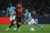 FILE -AC Milan's Strahinja Pavlovic and Napoli's Miguel Gutierrez, right, battle for the ball during the Italian Serie A soccer match between Napoli and Milan in Naples, Italy, April 6, 2026. (Alessandro Garofalo/LaPresse via AP, File)