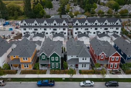 New single family houses billed as estate cottages and townhouses under construction are seen in an aerial view, in Delta, B.C., on Monday, Aug. 12, 2024. THE CANADIAN PRESS/Darryl Dyck