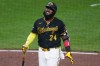 Pittsburgh Pirates' Marcell Ozuna collects himself after fouling off a pitch from Atlanta Braves pitcher Raisel Iglesias during the ninth inning of a baseball game in Pittsburgh, Wednesday, July 8, 2026. (AP Photo/Gene J. Puskar)