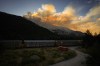 A CPKC train passes the Brunswick Creek wildfire burning in the mountains, in Boston Bar, B.C., on Thursday, July 9, 2026. THE CANADIAN PRESS/Darryl Dyck