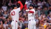 Boston Red Sox's Wilyer Abreu, right, is congratulated by Willson Contreras (40) after his solo home run during the third inning of a baseball game against the Chicago White Sox, Wednesday, Aug. 5, 2026, in Boston. (AP Photo/Charles Krupa)