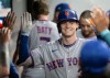 New York Mets' Carson Benge is congratulated by his teammates after hitting a solo home run of Cleveland Guardians starting pitcher Tanner Bibee during the fifth inning of a baseball game, Wednesday, Aug. 5, 2026, in Cleveland. (AP Photo/Phil Long)