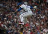 After striking out Cleveland Guardians' Angel Martinez during his Major League debut, New York Mets relief pitcher Jefry Yan reacts during the sixth inning of a baseball game, Wednesday, Aug. 5, 2026, in Cleveland. (AP Photo/Phil Long)