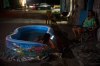 A girl cools off in a plastic pool in the street in Havana, Cuba, Tuesday, Aug. 4, 2026. (AP Photo/Ramon Espinosa)