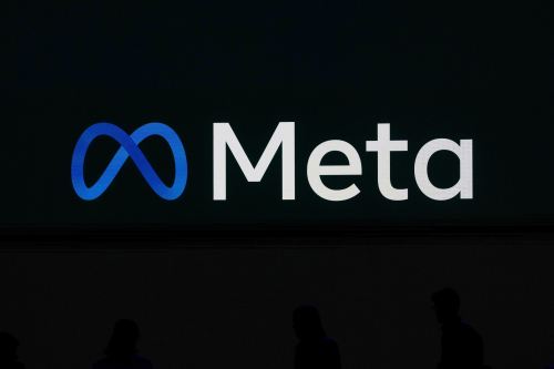 FILE - A Meta logo is shown on a video screen at LlamaCon 2025, an AI developer conference, in Menlo Park, Calif., April 29, 2025. (AP Photo/Jeff Chiu, File)