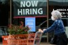 FILE - Hiring sign for sales professionals is displayed at a store, in Vernon Hills, Ill., Wednesday, April 15, 2026. (AP Photo/Nam Y. Huh, file)