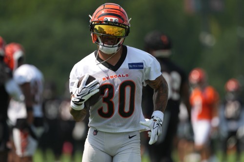 Cincinnati Bengals running back Chase Brown (30) carries the ball during practice at the team's NFL football training camp, Wednesday, July 29, 2026, in Cincinnati. (AP Photo/Kareem Elgazzar)