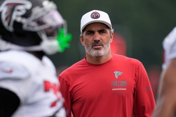 Atlanta Falcons head coach Kevin Stefanski watches the team work out during an NFL training camp, Friday, Aug. 7, 2026, in Flowery Branch, Ga. (AP Photo/Mike Stewart)