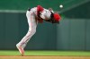 Cincinnati Reds shortstop Elly de la Cruz commits a fielding error on a ground ball hit by Washington Nationals' Brady House during the first inning of a baseball game, Friday, Aug. 7, 2026, in Washington. (AP Photo/John McDonnell)