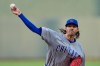 Chicago Cubs starting pitcher Kevin Gausman throws during the first inning of a baseball game against the Kansas City Royals, Friday, Aug. 7, 2026, in Kansas City, Mo. (AP Photo/Charlie Riedel)