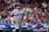 Toronto Blue Jays' Alejandro Kirk watches after hitting an RBI-sacrifice fly against Philadelphia Phillies pitcher Zack Wheeler during the third inning of a baseball game Friday, Aug. 7, 2026, in Philadelphia. (AP Photo/Matt Slocum)