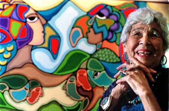 Daphne Odjig in 2006 in front of her 1991 painting Bond With The Earth. (Randy Quan / The Canadian Press files)