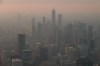 Buildings are seen from the observation deck of the CN Tower as smoke from forest fires in northwestern Ontario blankets the city of Toronto, Thursday, July 16, 2026. THE CANADIAN PRESS/Cole Burston
