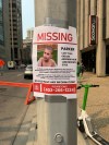 A poster listing information about Parker, a missing boy who has autism and is non-verbal, is pictured in Calgary, on Wednesday, July 22, 2026. THE CANADIAN PRESS/Bill Graveland