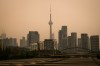 The CN Tower is pictured in Toronto as wildfire smoke fills the city, on Wednesday, July 15, 2026. THE CANADIAN PRESS/Laura Proctor