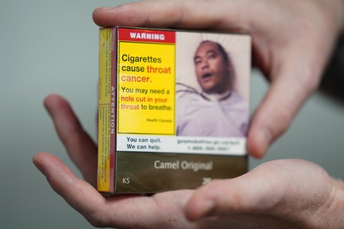 An example pack showing new cigarette package warnings is seen in a photo illustration made in Toronto, Saturday, July 18, 2026. THE CANADIAN PRESS/Giordano Ciampini