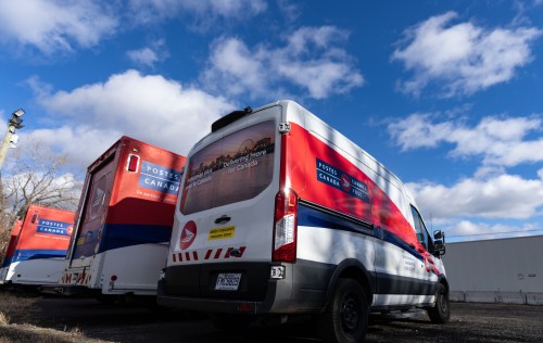 Canada Post mail trucks are seen parked in their distribution centre in Montreal, Wednesday, Nov. 27, 2024. THE CANADIAN PRESS/Christinne Muschi