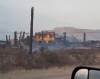 This handout still image from a video shot on Saturday, July 25, 2026, shows the smouldering aftermath of the Pear Lake wildfire that swept towards Clinton, B.C., a day earlier. THE CANADIAN PRESS/Handout — Facebook, Joey Johnson