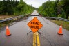 Warning signage is seen in front of a washed out road near Marble Mountain, in Cape Breton, N.S., Saturday, Sept. 5, 2026. THE CANADIAN PRESS/Steve Wadden