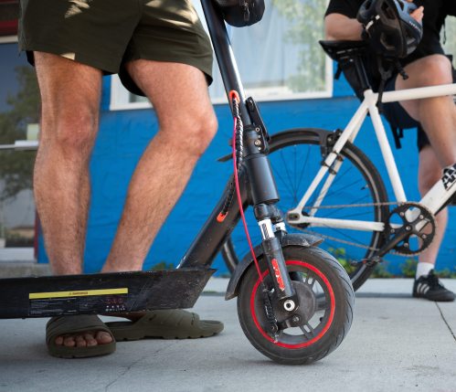ROBERT LEE / FREE PRESS Volodymyr Ishchenko rides his electric scooter through Winnipeg on Monday, August 24, 2026.