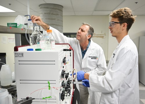 Gregory de Crescenzo, full professor in Polytechnique Montreal's Department of Chemical Engineering, left, and PhD student Benjamin Serafin demonstrate the protein purification process in the pandemic preparedness lab, in Montreal, on Wednesday, June 17, 2026. THE CANADIAN PRESS/Graham Hughes