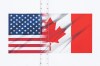 U.S. and Canada flags are seen on a transport truck trailer at the Pacific Highway Canada-U.S. border crossing in Surrey B.C., on Tuesday, March 4, 2025. THE CANADIAN PRESS/Ethan Cairns