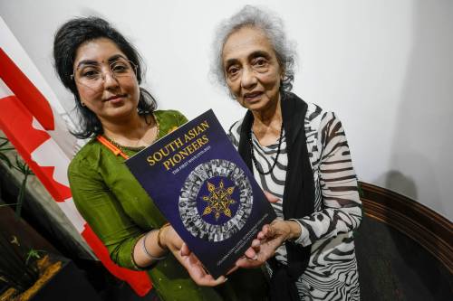 JOHN WOODS / FREE PRESS
                                Simran Bhinder, project lead, left, and Pamela Rebello, executive director of India School of Dance, Music & Theatre, are photographed at the book launch South Asian Pioneers at the Manitoba Legislature Sunday, June 28, 2026.