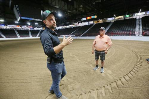 MATT GOERZEN / BRANDON SUN)
                                Devin Epp of the Keystone Centre (left) with footing technician Allan Quast explains how the facility readies the arena floor for Canada&rsquo;s National Arabian Championship, which starts Thursday in Brandon.