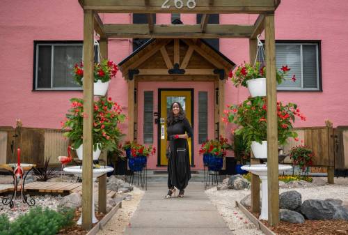 Photos by ROBERT LEE / FREE PRESS 
                                Beryl Boney, who grew up in Trinidad and Tobago, has spent 25 years transforming her block on St. Mary&rsquo;s Road with flowers and vegetables, including ceramic chickens that nod to her Caribbean roots.