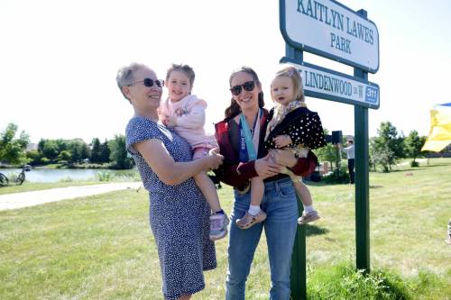 RUTH BONNEVILLE / FREE PRESS
                                The City of Winnipeg officially renamed Lindenwood Drive West Park in honour of two-time Olympic gold medallist curler Kaitlyn Lawes. The athlete attended the renaming ceremony with her two children Myla and Ella (right), and her mom, Cheryl Lawes.