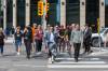 MIKE DEAL / FREE PRESS FILES
                                Pedestrians cross Portage and Main during the historic reopening of the intersection in 2025.