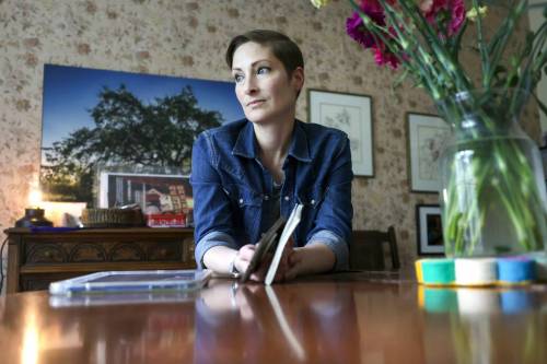 RUTH BONNEVILLE / FREE PRESS
                                LOCAL - digital legacy Portrait of Catherine Wreford and her little book of death-related/grief planning info and laptop in her home Wednesday. Catherine Wreford, a mother who&rsquo;s active on Facebook/Instagram and often posts vulnerable content about her terminal brain cancer diagnosis, has done a fair bit of physical and digital legacy planning. DIGITAL DEATH: A duo of researchers at the University of Manitoba have launched a study to better understand how Manitobans are preparing their &ldquo;digital legacies.&rdquo; In an era where digital footprints are complex and password-riddled, scholar Simon Wermie is looking for answers to help guide people who are grieving. Maggie Macintosh, Education Reporter Aug 5h,, 2026