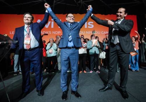 The Canadian Press
                                Avi Lewis (centre), the new leader of the NDP, celebrates with former interim leader Don Davies (left) and Manitoba Premier Wab Kinew at the party convention in Winnipeg on March 26, 2026.