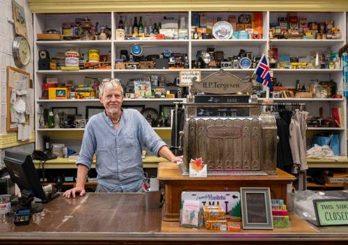 ROBERT LEE / FREE PRESS
                                Stefan Tergesen, owner of H.G. Tergesen & Sons, poses with the &ldquo;new cash register&rdquo; which is from 1910, inside his store on Tuesday, August 18, 2026. The store has stood in the same spot since January 1, 1899.