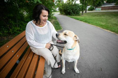 MIKAELA MACKENZIE / FREE PRESS
                                Tara Miller and her dog, Corbi, on Thursday, Aug. 13, 2026. Miller has had to make some difficult decisions regarding Corbi&rsquo;s vet care, and animal shelters say rising vet bills are forcing more people to surrender their pets. For Tiago story. Free Press 2026