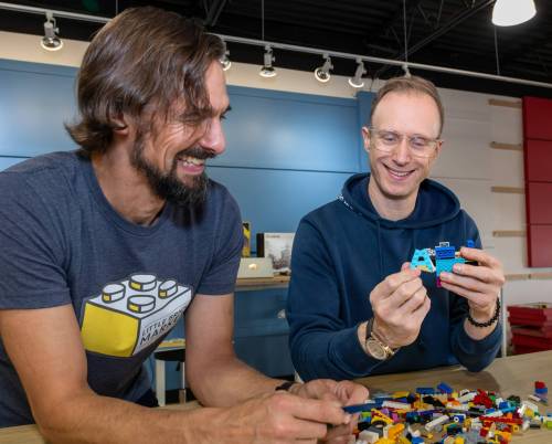 ROBERT LEE / FREE PRESS
                                Ian Makita (left) and Jason Poturica, co-owners of The Little Brick Market, examine some Lego pieces at their new store.