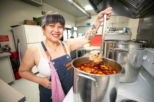 MIKAELA MACKENZIE / FREE PRESS 
                                Streat Feast vendor Marilyn Magtoto prepares the sinigang for her sinigang birria tacos.