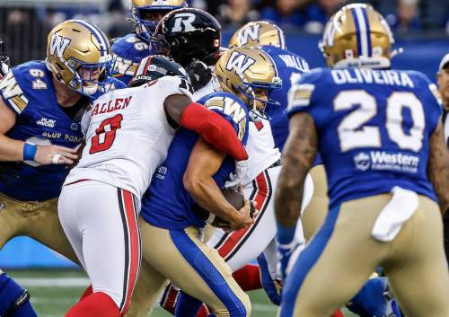 John Woods / THE CANADIAN PRESS
                                Winnipeg Blue Bombers quarterback Zach Collaros gets sacked by Ottawa Redblacks linebacker A.J. Allen, one of four on the evening.