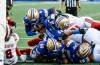 Winnipeg Blue Bombers quarterback Bryce Perkins (9) dives in for the short yardage touchdown against the Ottawa Redblacks during first half CFL football action in Winnipeg on Friday, August 14, 2026. THE CANADIAN PRESS/John Woods
