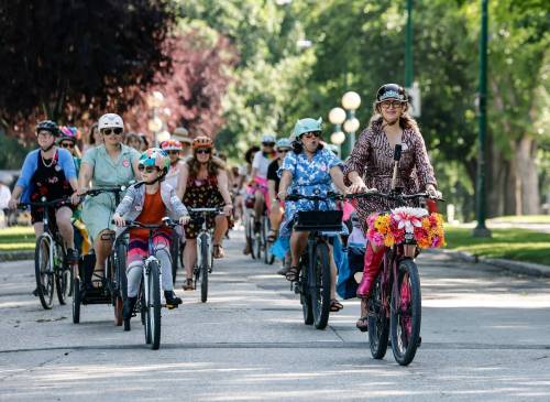 JOHN WOODS / FREE PRESS
                                Patty Wiens leads as women participate in the Fancy Women Bike Ride at the Legislature grounds on Sunday.