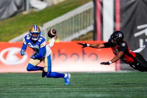 SPENCER COLBY / THE CANADIAN PRESS FILES
                                Winnipeg Blue Bombers wide receiver Ontaria Wilson (80) locks in on a pass in front of Redblacks defensive back Adrian Frye (22) in Ottawa on in 2025.