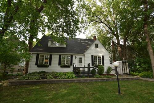 Photos by Todd Lewys / Free Press
                                Surrounded by mature trees on a huge lot, the 1,612 sq. ft., two-storey home projects a distinct cottage-like vibe.