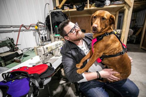 MIKAELA MACKENZIE / FREE PRESS 
Andrew Churley, co-owner/co-founder of Crash Safe Dog (a Manitoba business that manufactures dog harnesses for safe pet travel), with his dog Maze on Friday, Jan. 16, 2026. For Aaron story. Free Press 2026