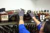 BRANDON SUN FILES
A liquor mart employee helps stock American alcohol onto shelves