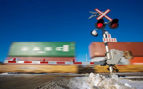 MIKE DEAL / WINNIPEG FREE PRESS A train crosses Community Row close to Wilkes Avenue Monday afternoon. 190107 - Monday, January 07, 2019.