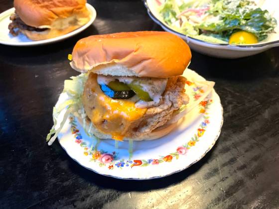 Nonsuch’s veggie burger features a perfectly steamed slice of breaded squash. (Eva Wasney / Free Press)