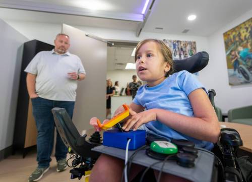 ROBERT LEE / FREE PRESS
                                Braelynn Bodman enjoys some time playing XBOX using custom controllers as seen in the Smart Suite officially opened today at the Rehabilitation Centre for Children in Winnipeg on Wednesday, August 26, 2026. The Smart Suite helps children with disabilities gain greater independence at home.